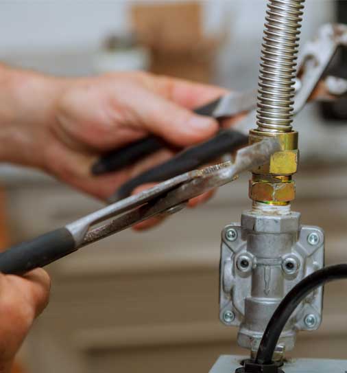 Plumber fixing gas line